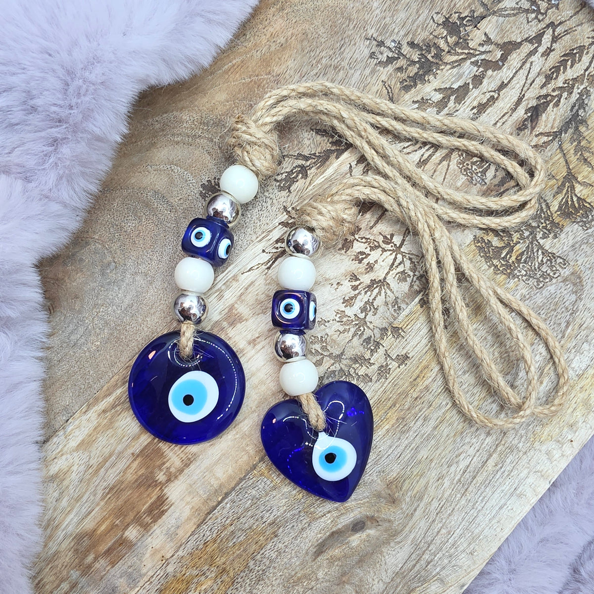 Evil eye onnenamuletti