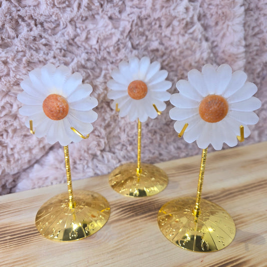 "Daisy" seleniittikukka telineessä